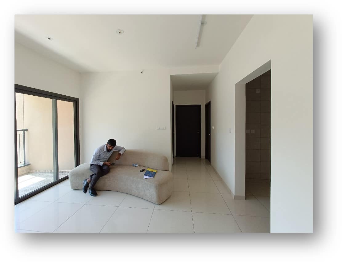 Modern bare shell apartment living area in Bangalore during site measurement by Olangana Design, ready for stunning interior transformation.