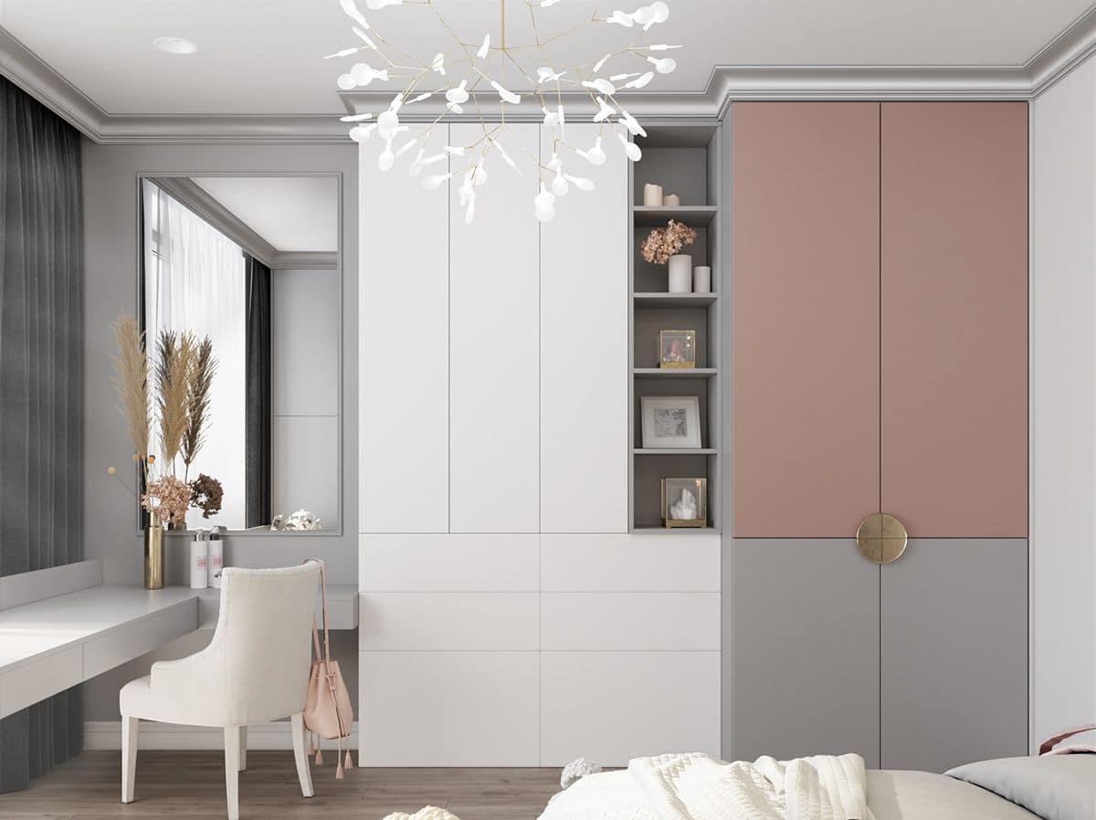 Elegant bedroom interior design by Olangana in Bangalore, featuring custom built-in wardrobes in white, dusty rose, and grey, a modern chandelier, and a minimalist dressing table.