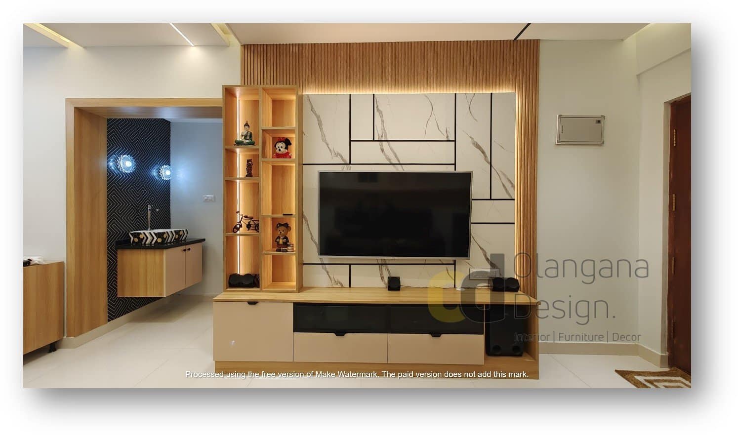 Modern TV unit with integrated sink area, under-sink cabinets, and top lighting designed by Olangana Design in Bangalore