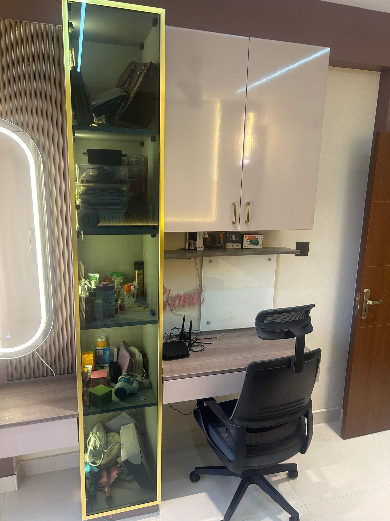 Modern modular master bedroom interior with study workspace, smooth wardrobe cabinets, and large window ventilation designed by Olangana Design’s.