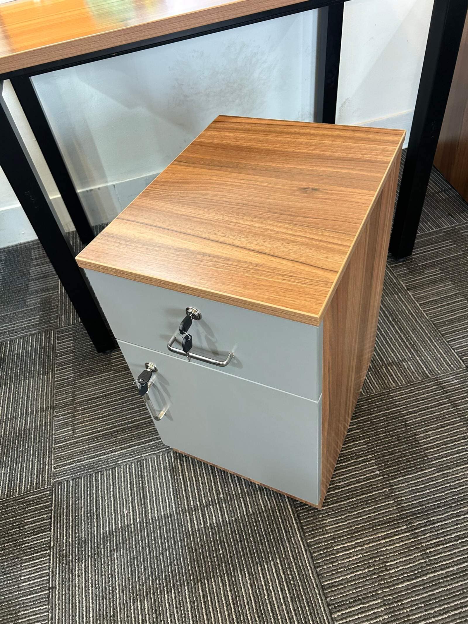 Compact office drawer cabinet with wooden top and lockable storage unit in Bangalore office interior by Olangana Designs