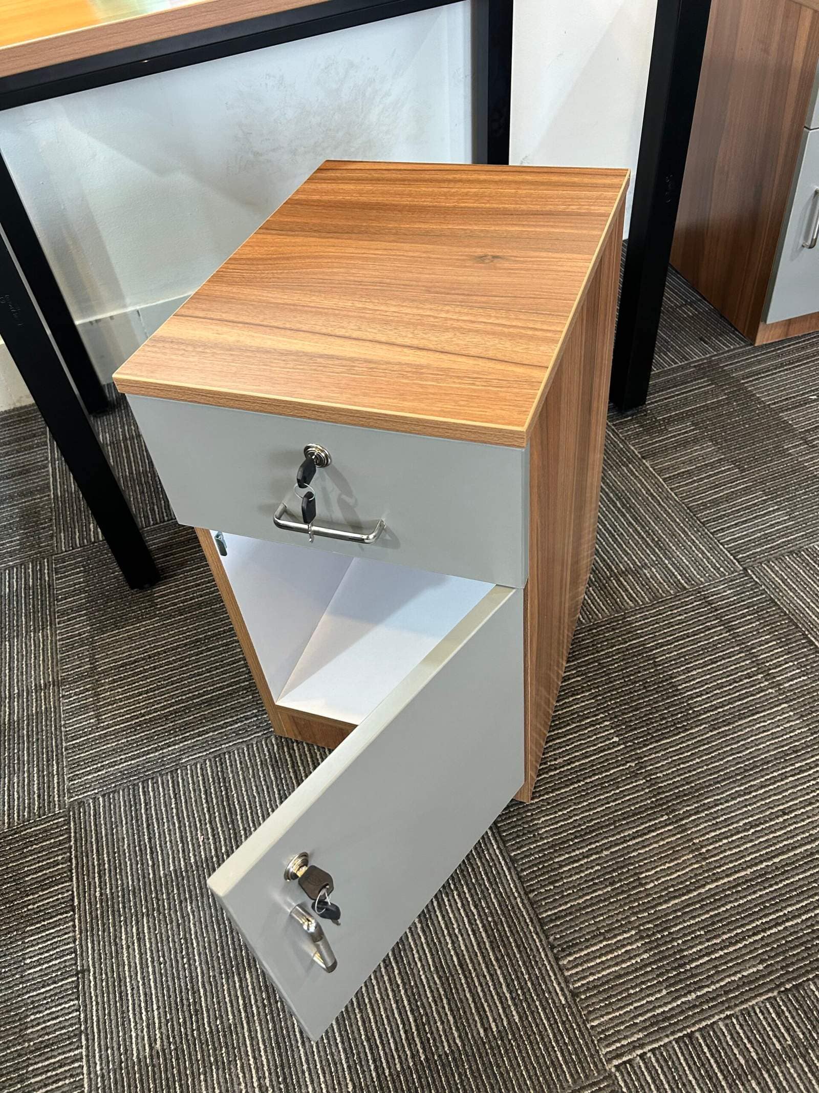 Modern office storage cabinet with lockable drawer and wooden finish in Bangalore workspace by Olangana Designs