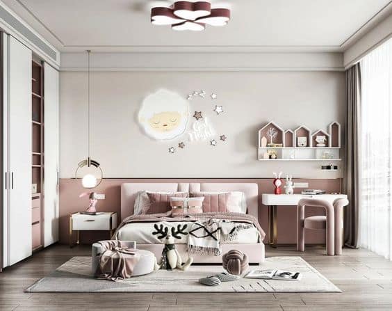 Pink and white modern girl's bedroom interior design by Olangana Design in Bangalore, featuring a plush bed, cute sheep wall decor, and functional storage.