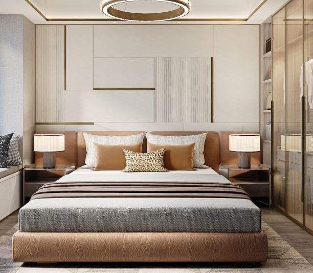 Modern luxury bedroom interior with brown upholstered bed, geometric wall paneling, and integrated wardrobe, expertly designed by Olangana Design in Bangalore.