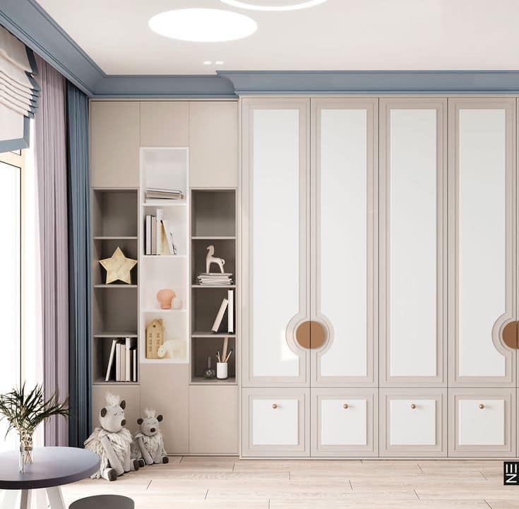 Elegant children's bedroom interior design by Olangana Design in Bangalore, featuring custom built-in wardrobes, open shelving with decor, and a soft color palette.