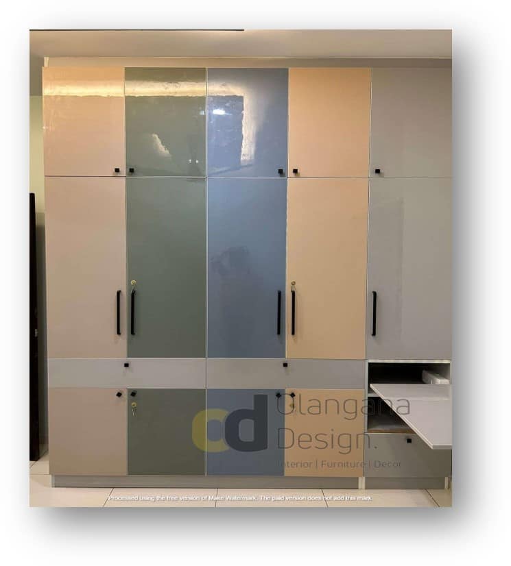 Modern multi-colored wardrobe and custom storage unit by Olangana Design, enhancing a contemporary interior in Bangalore.