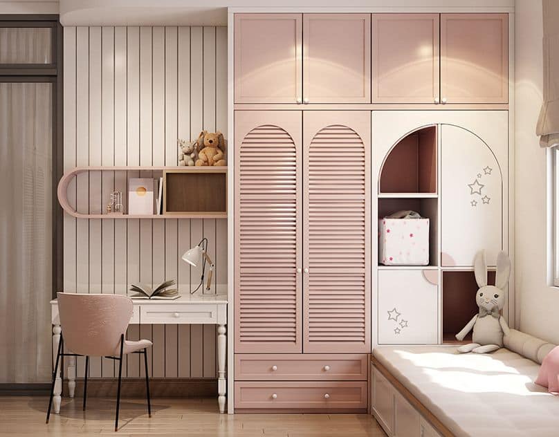 Elegant children's bedroom interior design by Olangana in Bangalore, featuring custom pink wardrobes, a study desk, and integrated shelving with a soft, inviting color scheme.