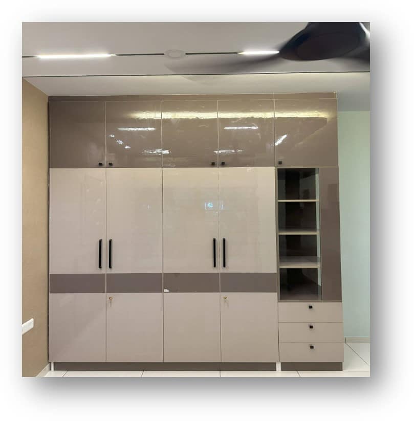Front view of Modern glossy wardrobe design by Olangana Design, offering ample storage for contemporary interior in Bangalore.