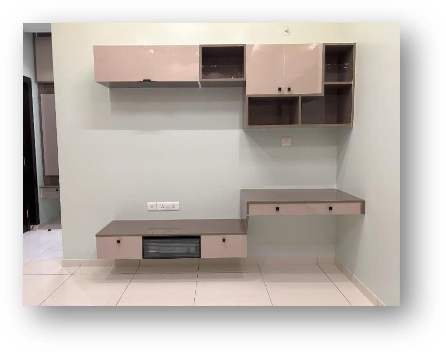 Modern floating wall unit with glossy beige cabinets, open shelves, and an integrated study desk, expertly designed for contemporary interior spaces by Olangana Design in Bangalore.