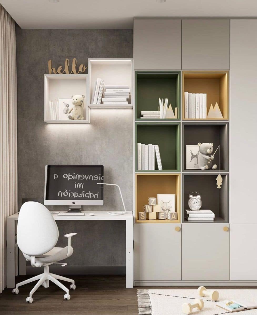 Modern kids study room interior with white desk, ergonomic chair, integrated wall shelves, and modular storage unit, designed by Olangana Design in Bangalore.